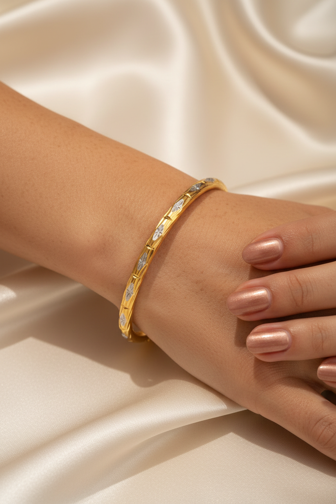 Doha two-tone gold bangle on-wrist single wear