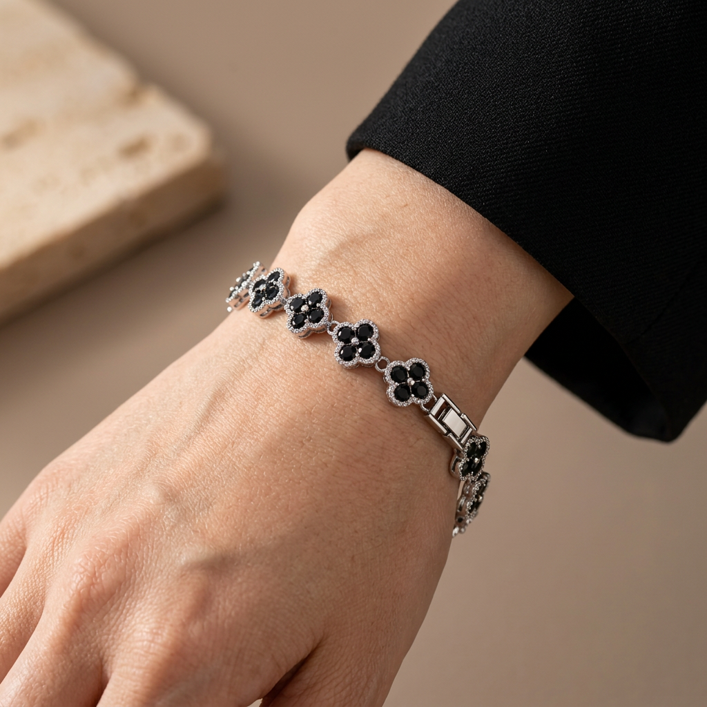 Black clover bracelet worn on a model's wrist