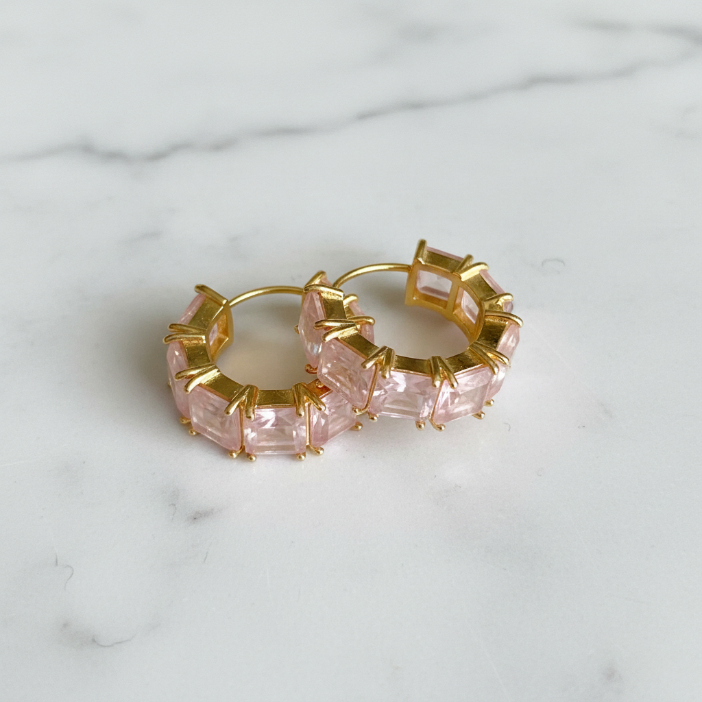 Kennedy pink rose quartz stone huggie hoop earrings flat lay on white marble
