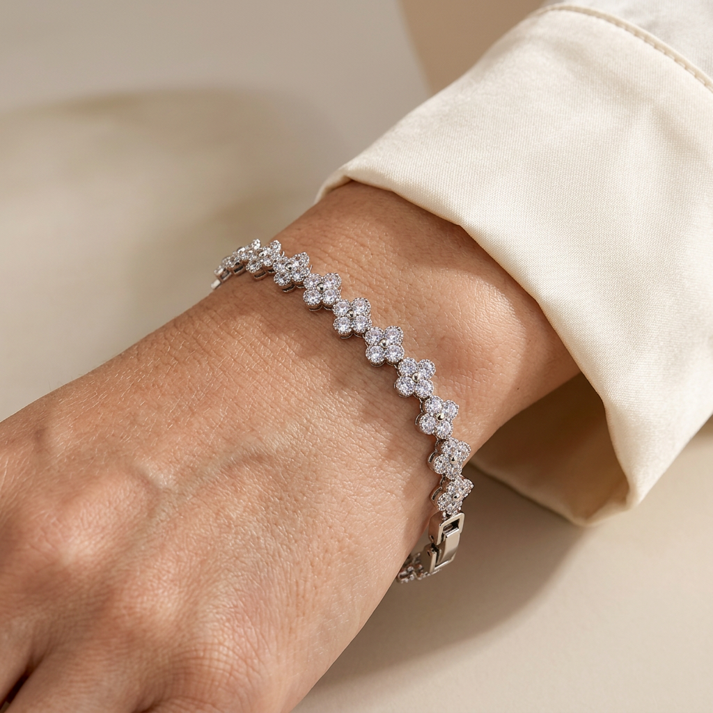 White crystal clover bracelet worn on a model's wrist