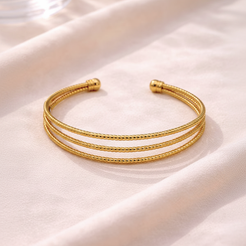 Bianca triple-row gold cuff bracelet close-up texture detail