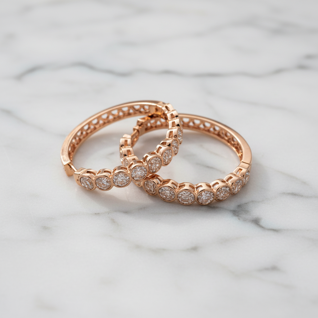 Madrid rose gold diamond hoop earrings flat lay on white marble