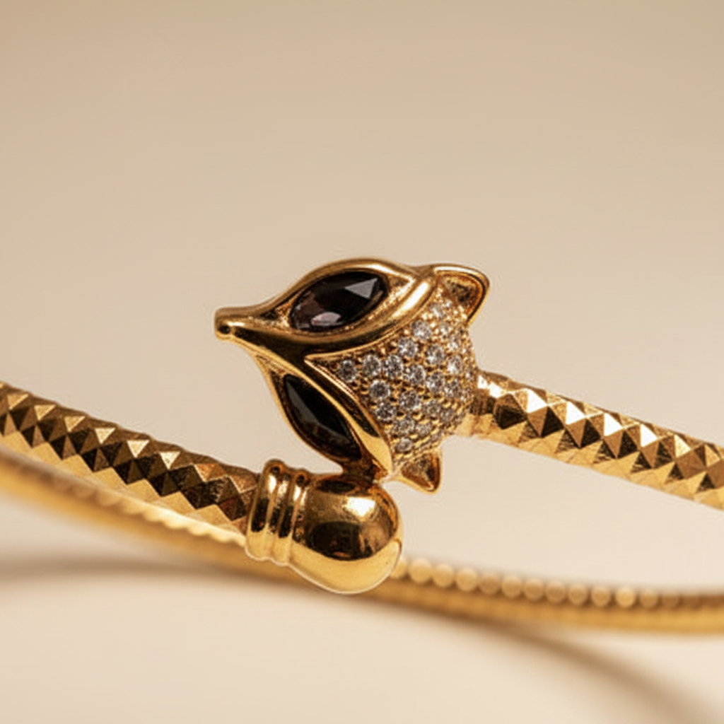 Celeste gold cat head cuff bracelet close-up cat head pavé crystal detail