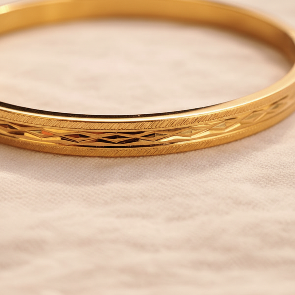 Anaya gold engraved bangle bracelet close-up engraved detail