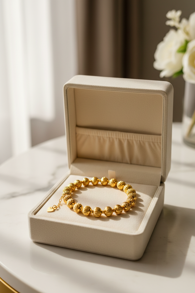 Eleanor gold diamond-cut ball bead bracelet gift display on velvet tray