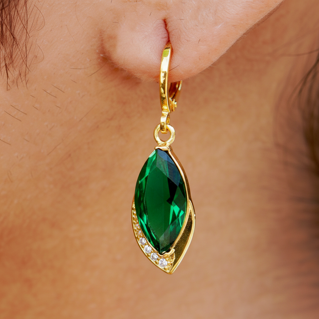 Sawyer emerald drop earrings close-up marquise stone and pavé detail