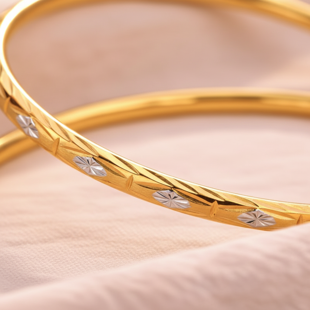 Doha two-tone gold bangle close-up engraved leaf detail