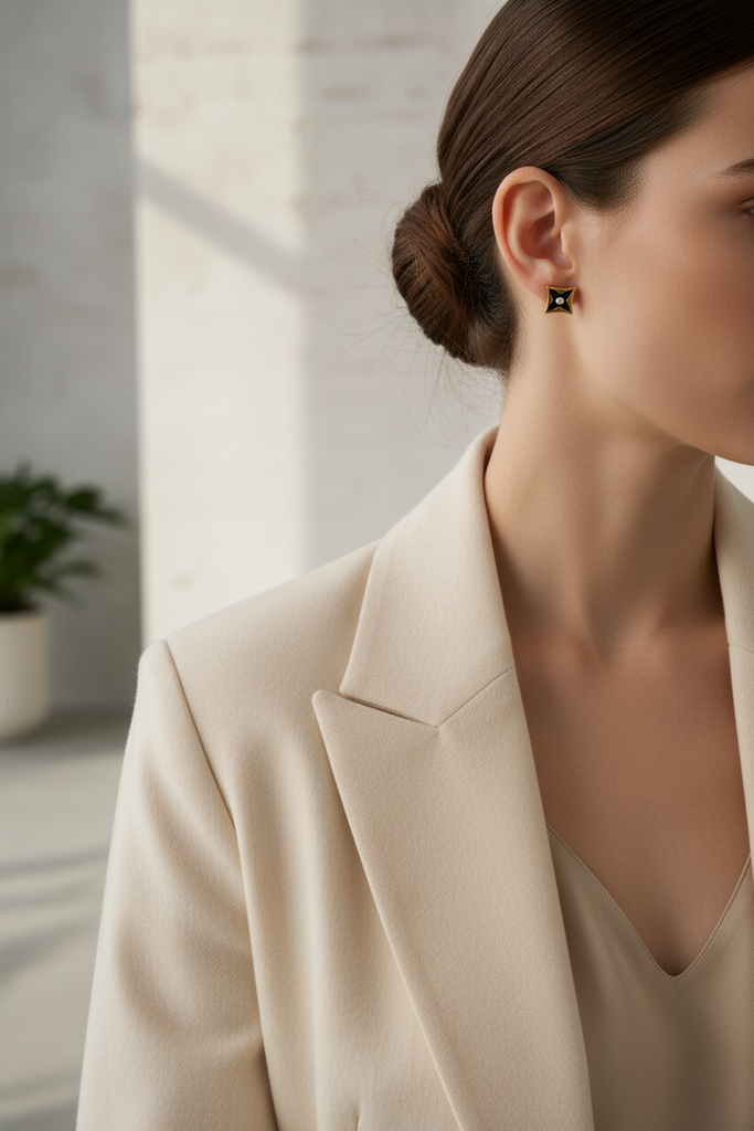 Lisbon gold and black star motif stud earrings styled with minimalist work outfit