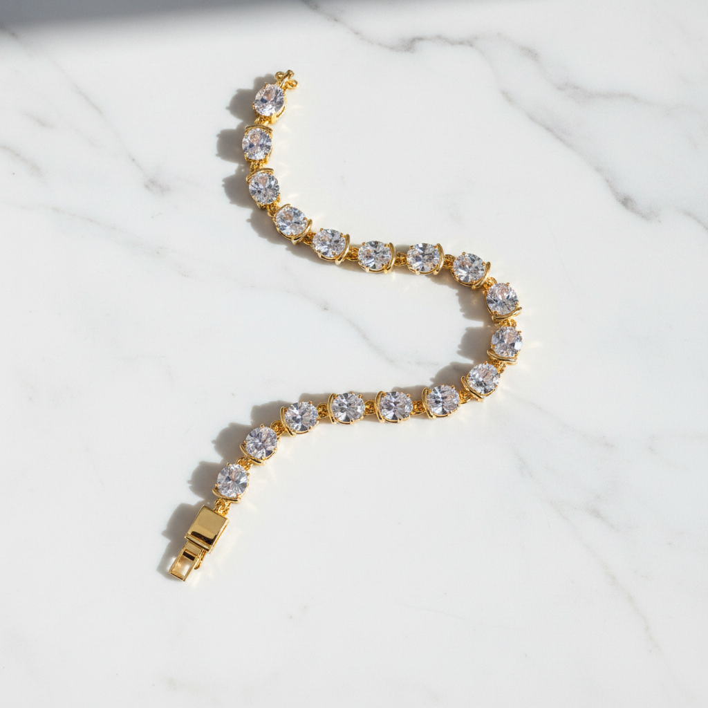 Winthrop tennis bracelet gold and white oval-cut stones flat lay on white marble