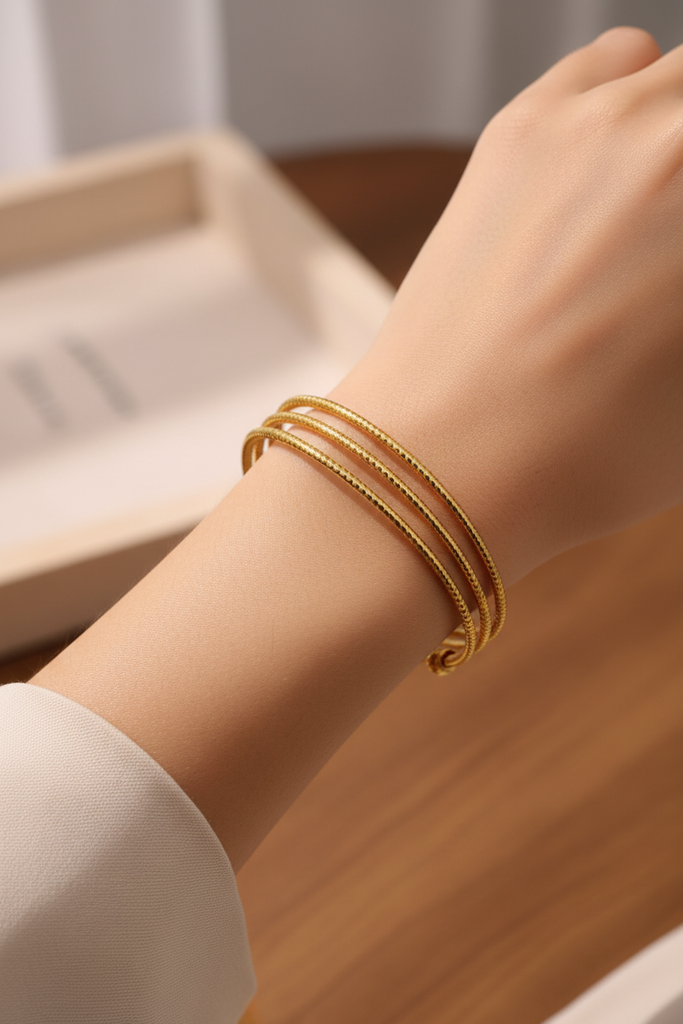 Bianca triple-row gold cuff bracelet on-wrist lifestyle