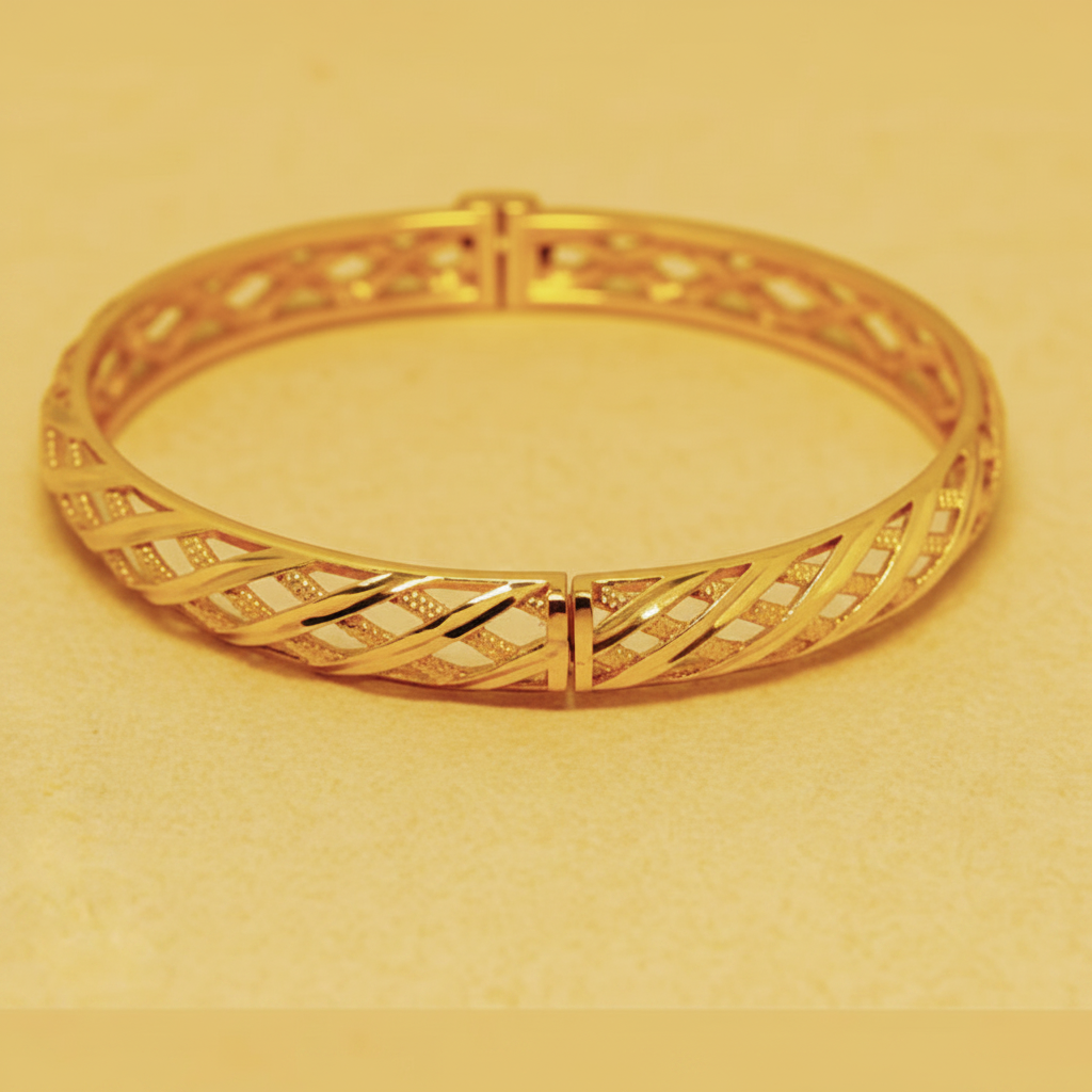 Valencia gold lattice bangle close-up openwork diagonal lattice and hinged clasp detail