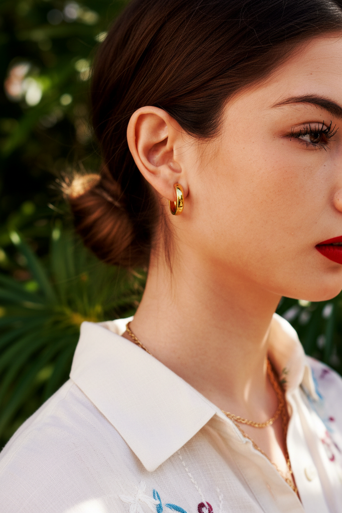 Wynn gold-tone stainless steel huggie hoop earrings styled with casual chic everyday outfit