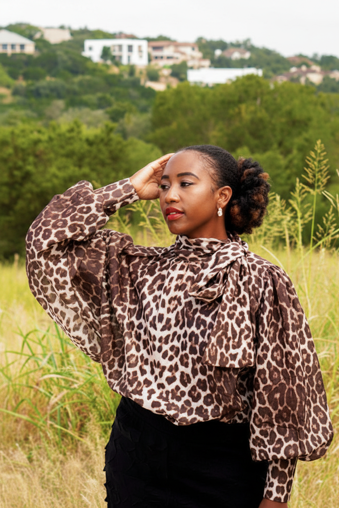 Thema Leopard Top - hand raised lush green outdoor field