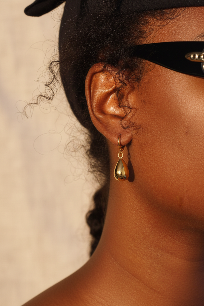 Winona polished gold teardrop dangle earrings on-ear quiet luxury lifestyle