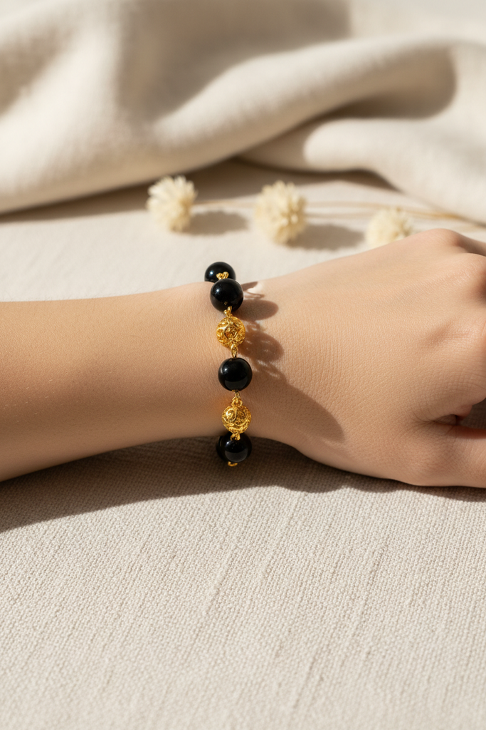 Elizabeth black resin and gold filigree ball bracelet on-wrist single wear