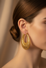 Delores Filigree Hoop Earrings worn on ear, lifestyle shot