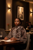 Thema Leopard Top - seated at upscale restaurant event