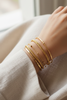 Langley gold twisted rope-braid open cuff bracelet stacked bangle styling