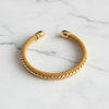 Venice gold mesh cuff bracelet flat lay on white marble