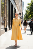 Julia Yellow Two-Piece Set - sunlit city street upscale shopping district