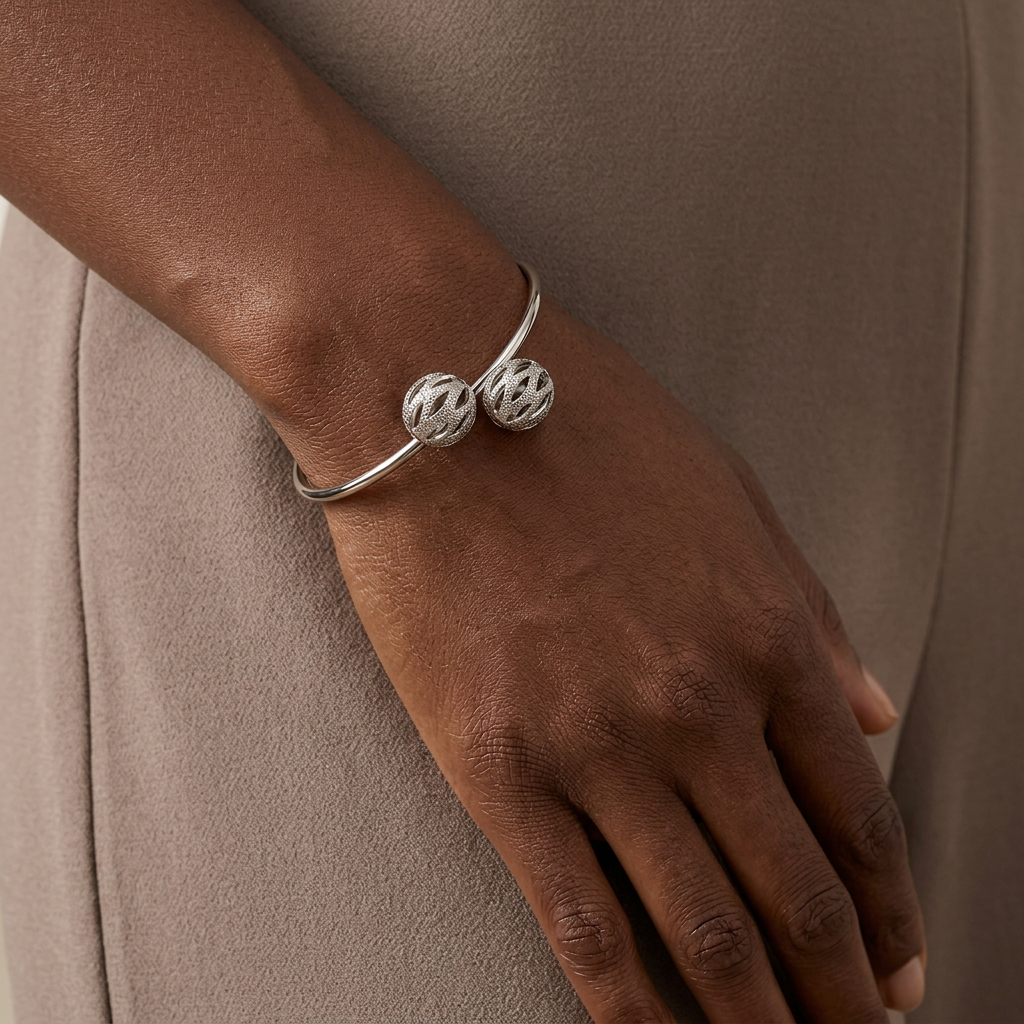 Model wearing the Leighton white gold-dipped filigree ball cuff bracelet