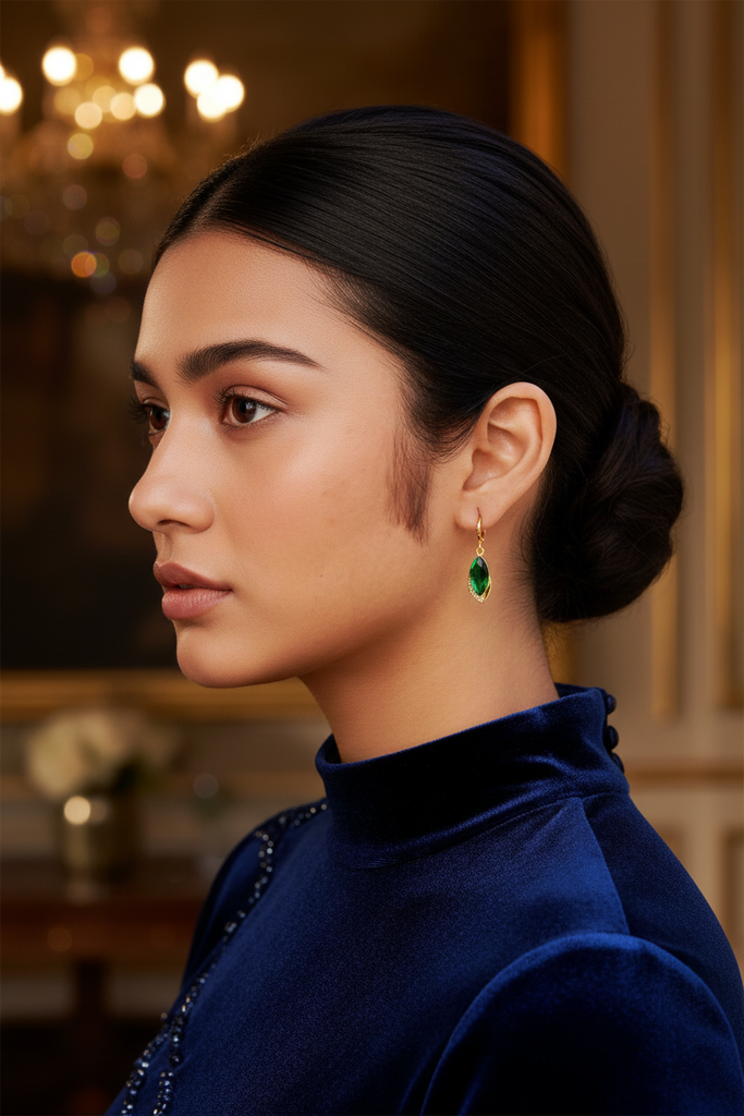 Sawyer emerald drop earrings styled with elegant evening outfit