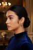 Sawyer emerald drop earrings styled with elegant evening outfit
