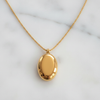 Njau Necklace - flat lay white marble