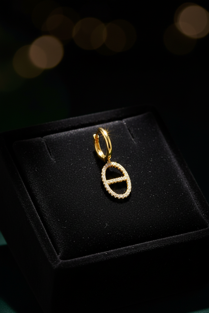 Addison gold diamond drop earrings on dark velvet jewelry tray