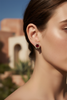 Ibiza ruby red floral crystal halo stud earrings on-ear lifestyle