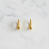Tallulah gold filigree huggie hoop earrings flat lay on white marble