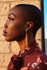 Georgie gold fringe tassel earrings side profile on-ear lifestyle shot