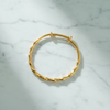 Rome gold bamboo bangle flat lay on white marble