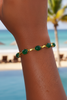 Halona cabochon emerald and gold bracelet beach resort on-wrist