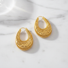 Delores Filigree Hoop Earrings flat lay on white marble