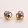 Langlet gold-plated purple crystal stud earrings close-up macro detail shot