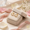 Savannah gold crystal stud earrings on cream linen with soft florals gift display