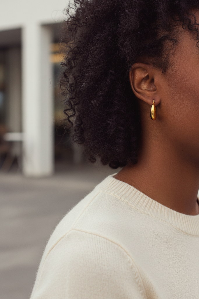 Dyani chunky gold crescent hoop earrings styled with everyday outfit
