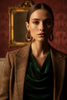 Riley burgundy gold stripe statement earrings styled with rich elegant outfit