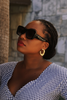 Melanie abstract crescent gold huggie hoop earrings on-ear lifestyle