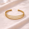 Bianca triple-row gold cuff bracelet close-up texture detail