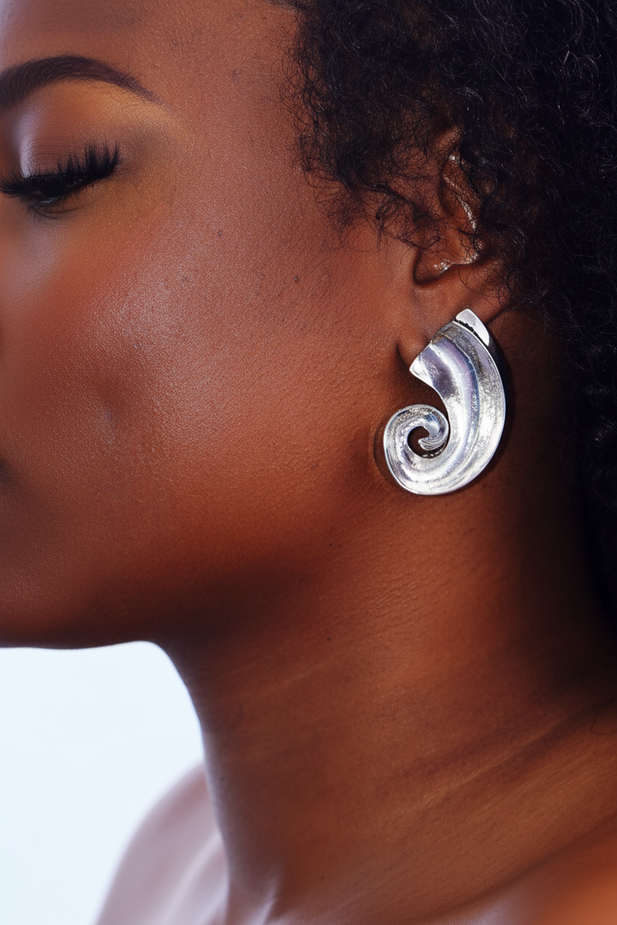 Kilgory silver swirl statement earrings on-ear lifestyle shot