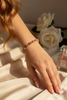 Winthrop tennis bracelet gold and pink stones on-wrist single wear
