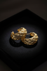 Ekow gold plated filigree semi hoop earrings on dark velvet jewelry tray
