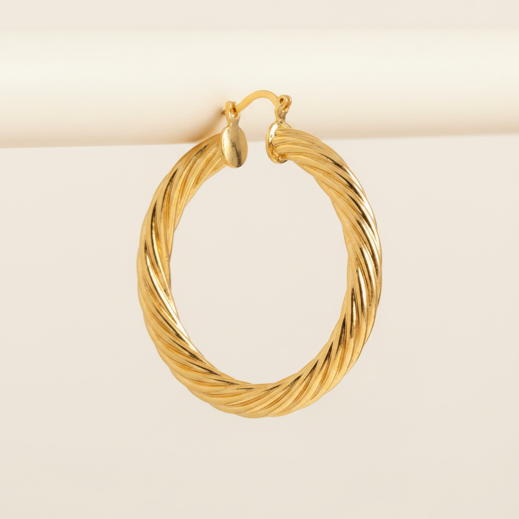 Efia gold plated twist hoop earrings close-up spiral texture detail