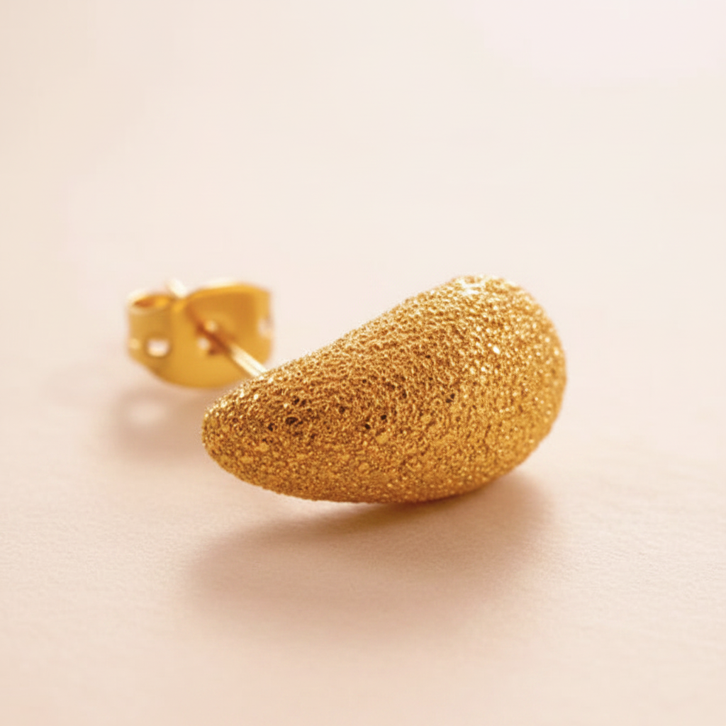Ronan gold textured stud earrings close-up stardust texture detail