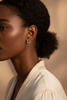 Savannah gold crystal stud earrings on-ear lifestyle editorial shot