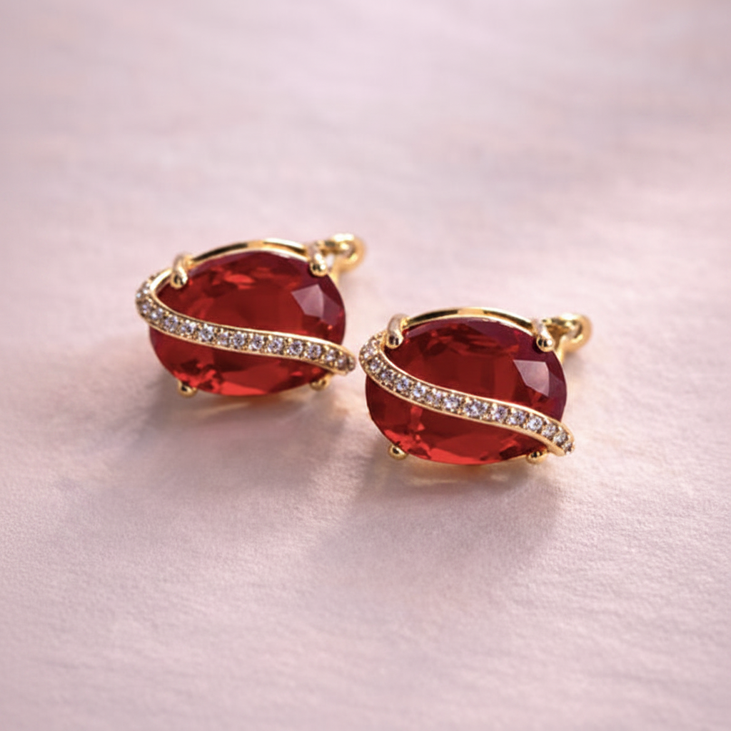 Arlette ruby red oval stone stud earrings close-up pave crystal ribbon detail