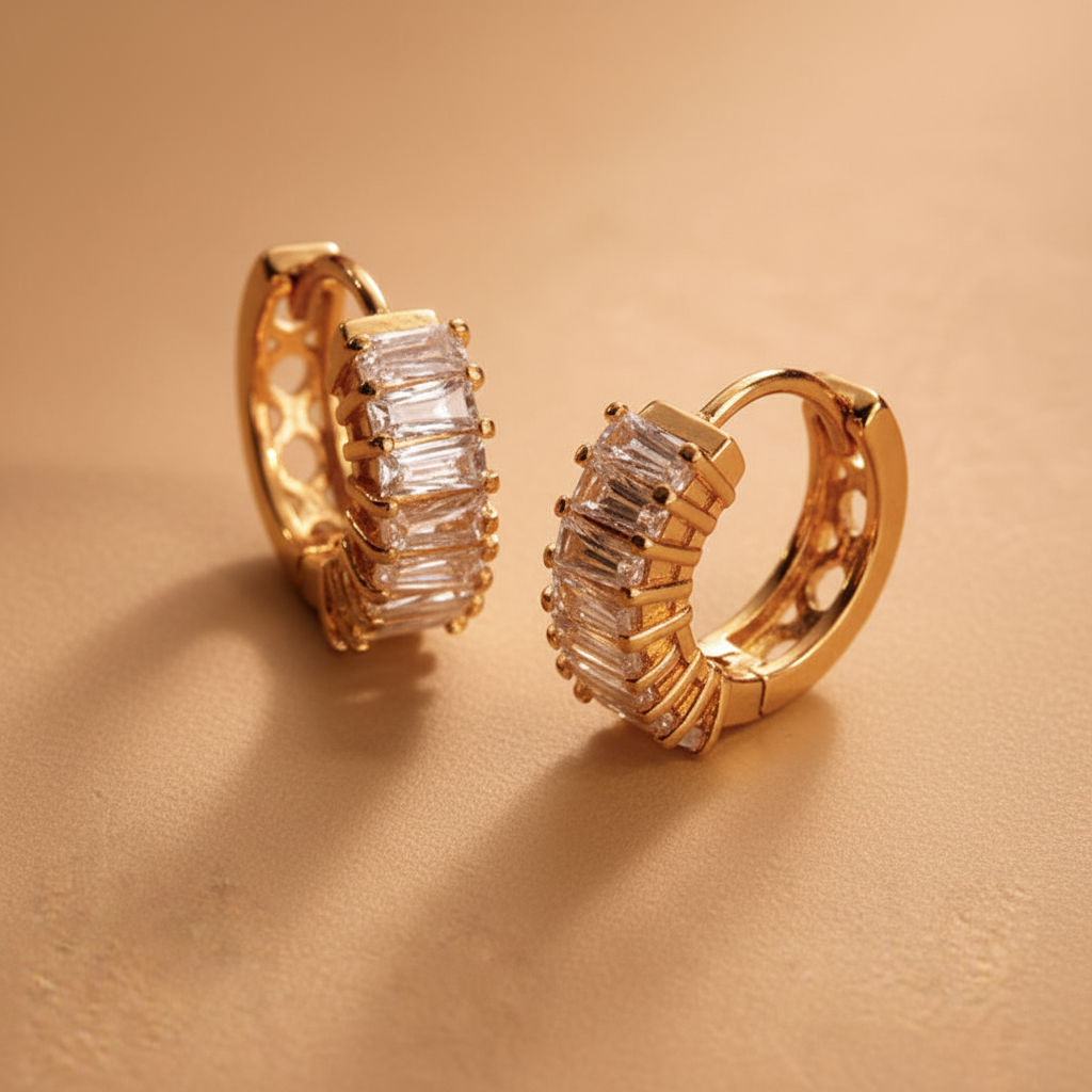 Capri gold plated huggie earrings close-up baguette crystal detail