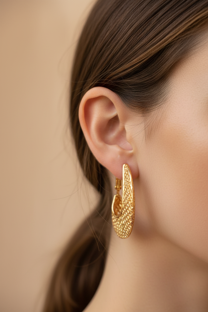 Quinn gold filigree caged hoop earrings side profile close-up on ear